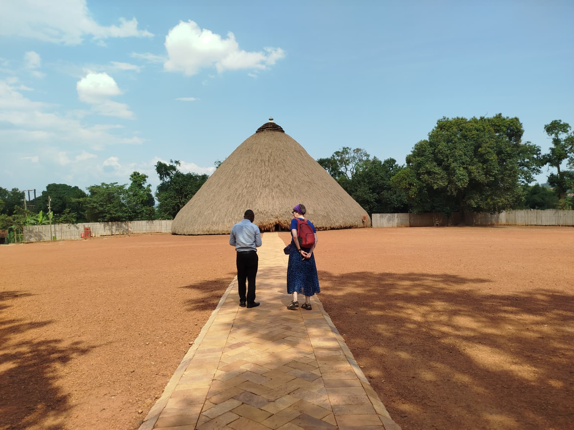 Visitors walking toward the Kasubi Royal Tombs in Buganda